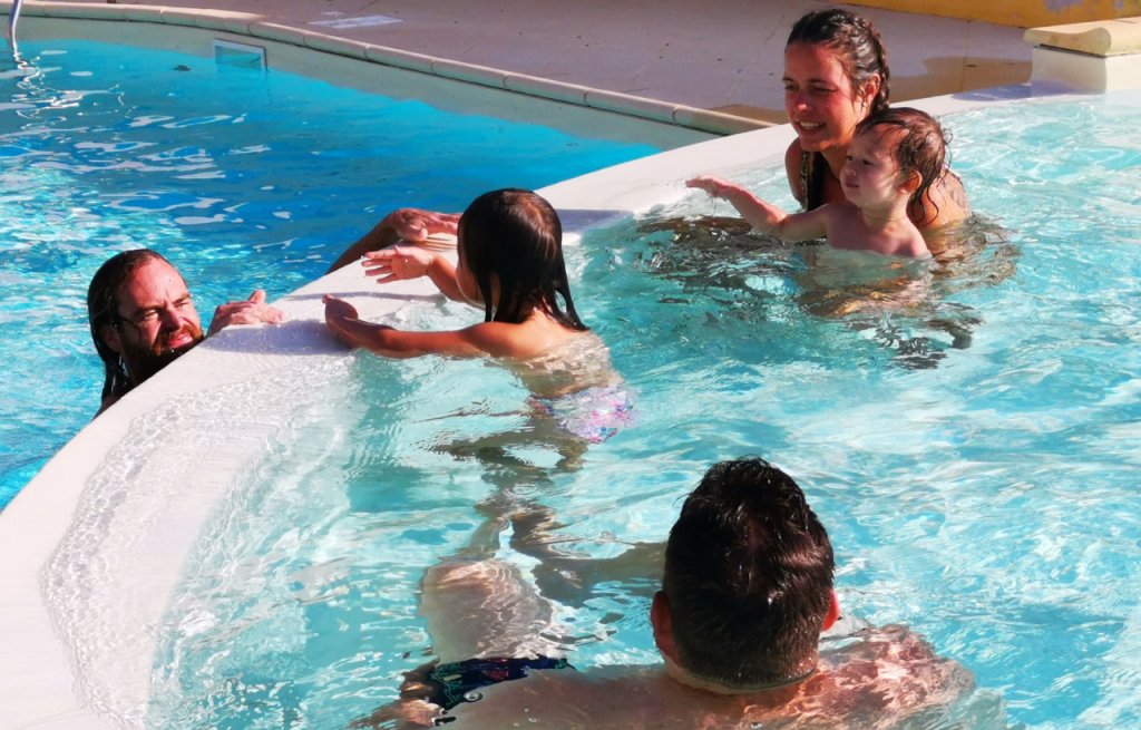 Having fun in the pool with Thierry's family.