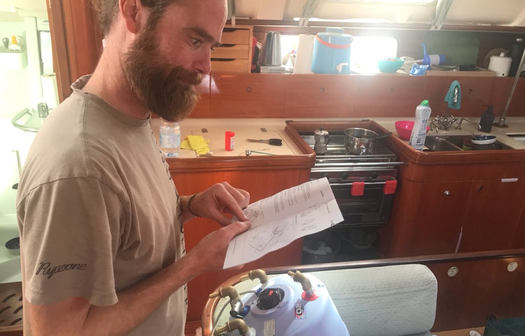 Captain studying the installation guide of our new water heater.