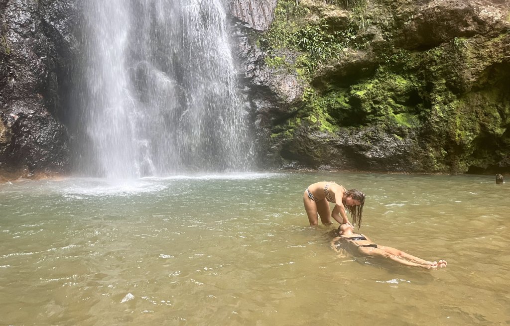 Rinsing it off in the pool of the waterfall.