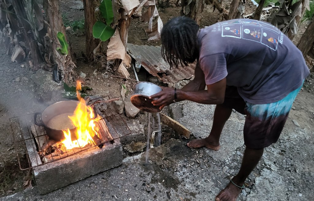 Cooking on the fire.