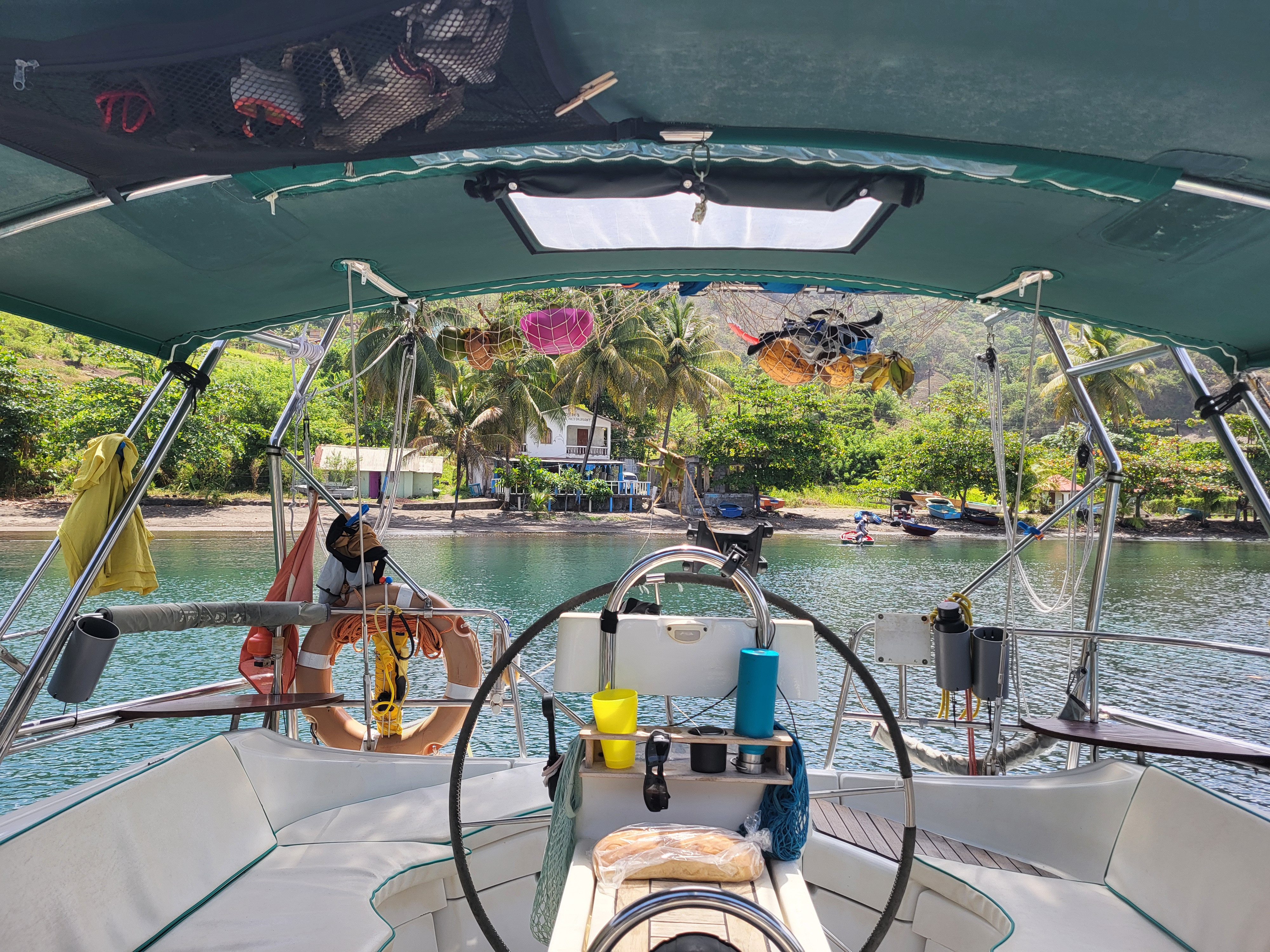 Stern of Cervino tied up onto a palm tree.