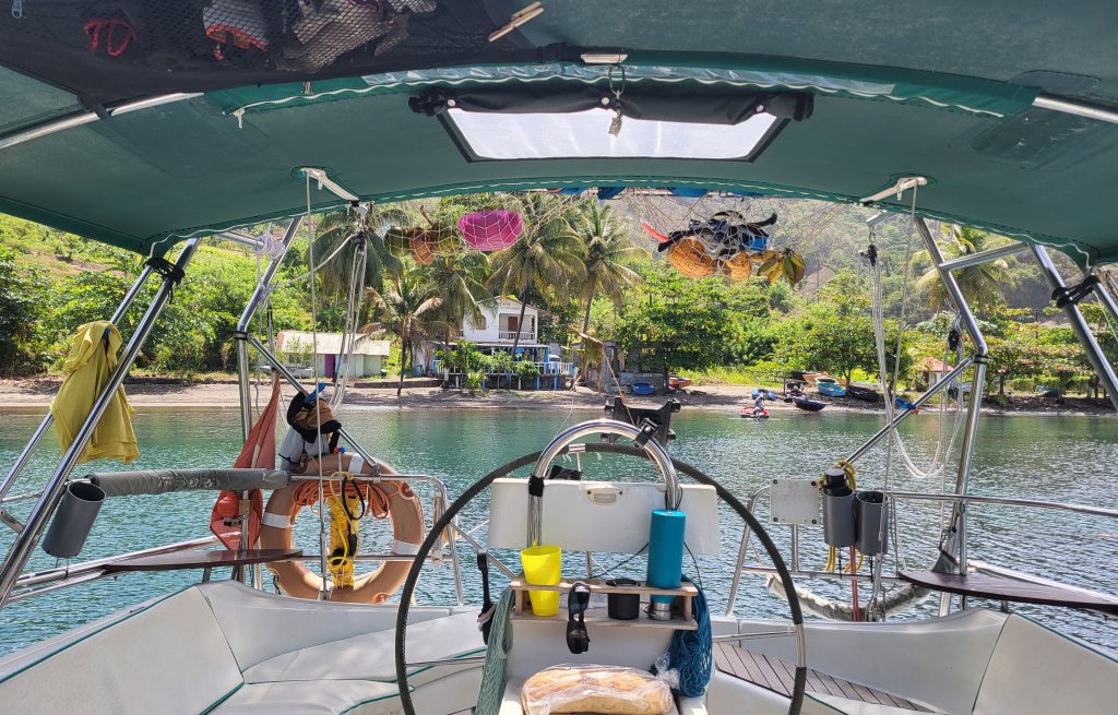 Stern of Cervino tied up onto a palm tree.