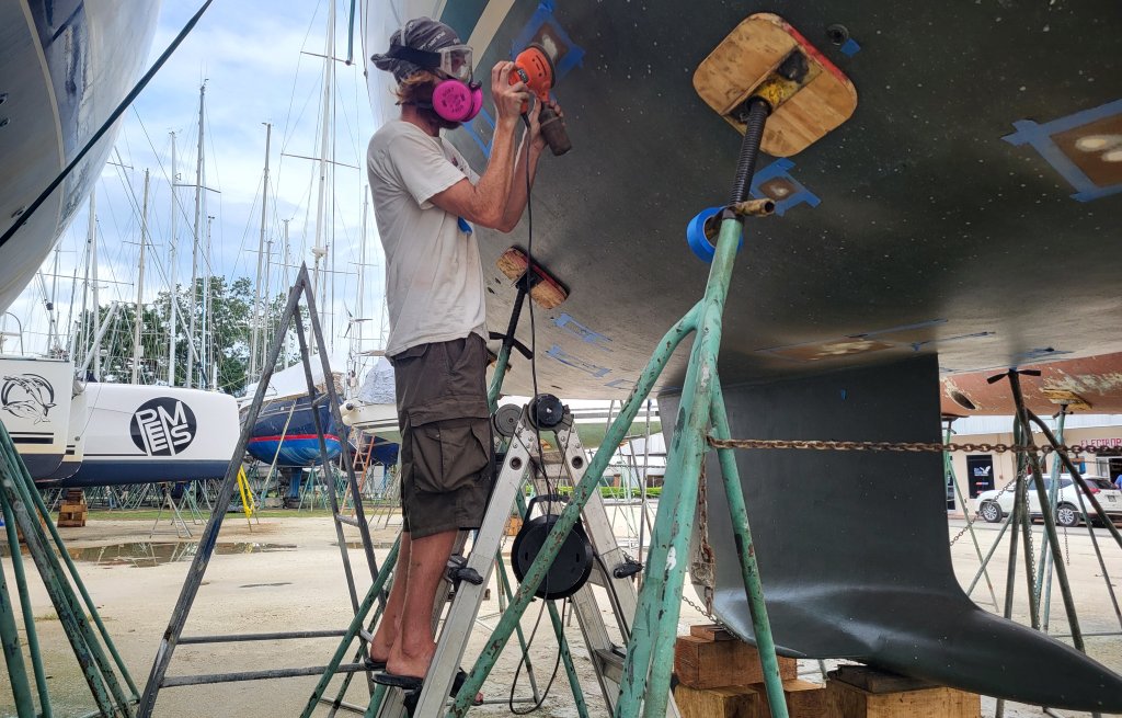 Thierry, preparing and sanding the hull.