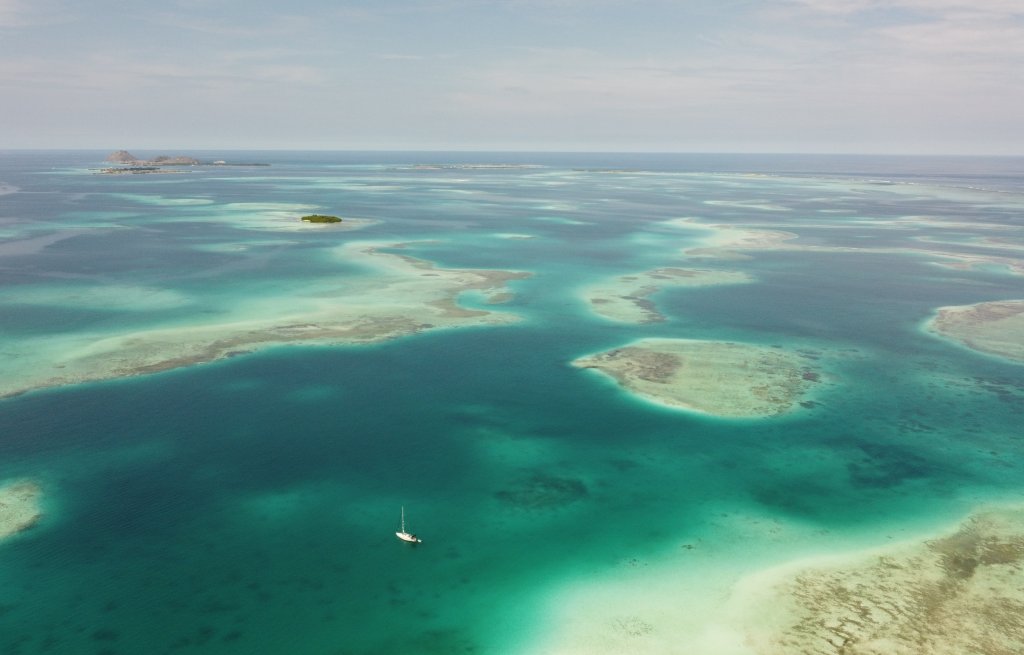 The beautiful reefs on the eas side of the archipelago. Gran Roque in the top left corner.