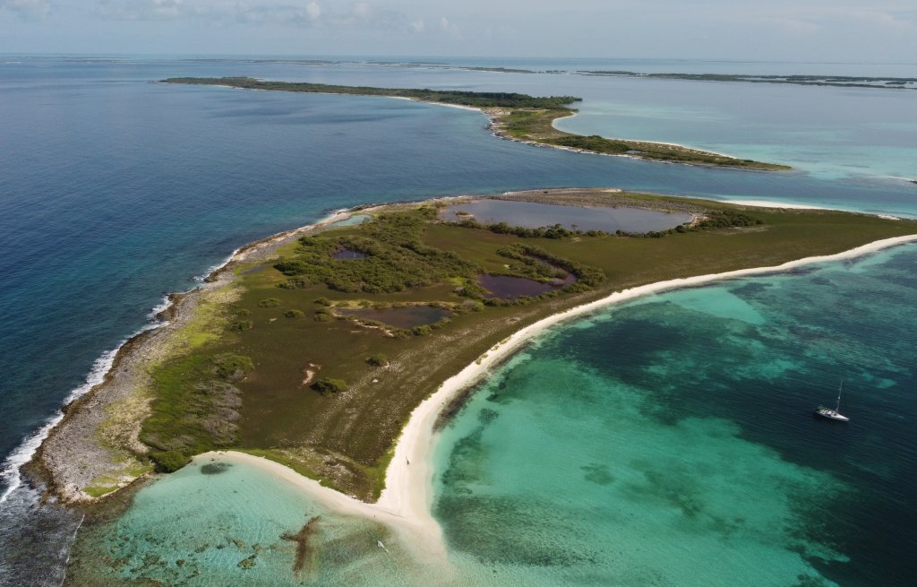 Cervino in front of Sarky, with reddish Flamingo lagoons.
