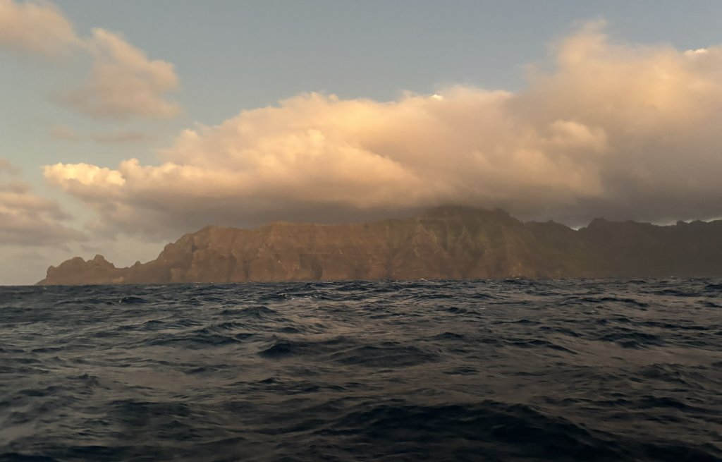 The island of Tauhata rises out of the deep sea.