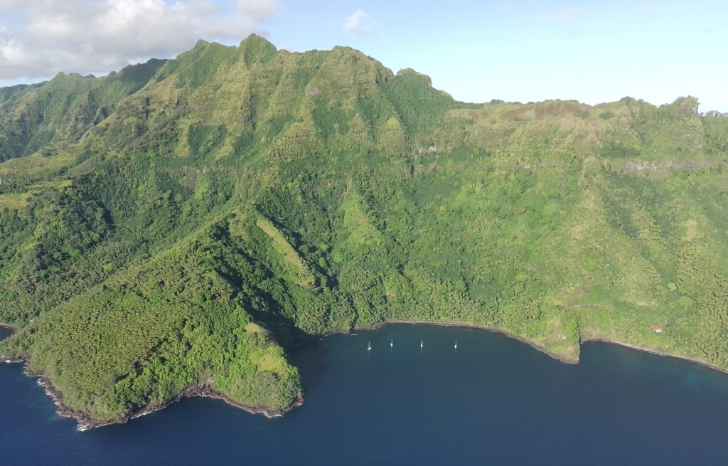 There lies our anchor, dug deep into the sand at the foot of the highest mountain of the island.