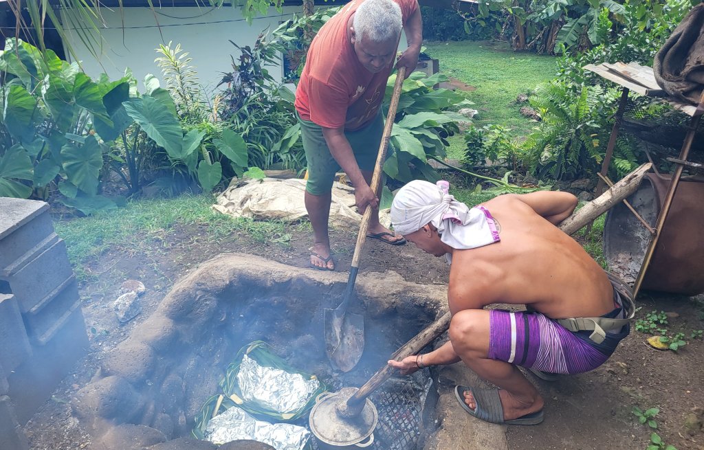 The baskets and pots are placed in a charcoal-filled hole in the ground and covered with hot stoned.
