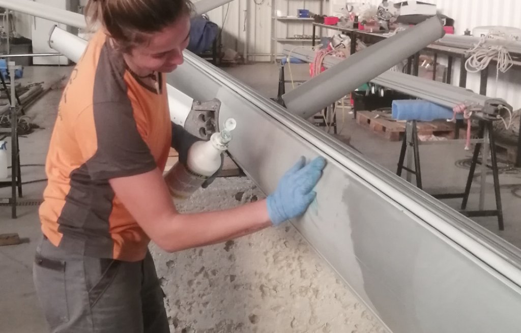 Polishing the mast with a lot of love.