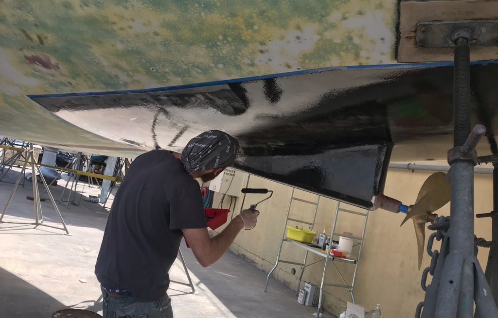 Applying barrier coat on the patches with blisters.