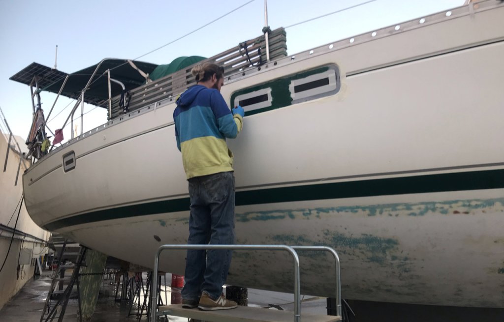 Painting the windows green.